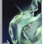 The outline of a person, lit in green, with butterflies.