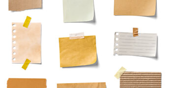 image of notes colored browns, beiges, yellows, light green, white, taped against white wall