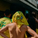 Soccer player with jersey over head.