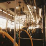 An image of the inside of a bus further to the back in soft warm lighting.