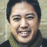 Headshot of author and English professor Chris Santiago.